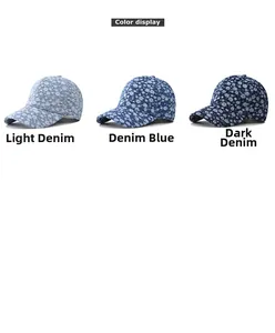 Detailed view of three denim floral baseball caps in light, medium and dark blue shades