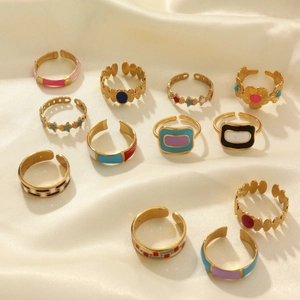 Set of 12 vintage 18k gold plated open rings with colorful enamel floral and geometric designs