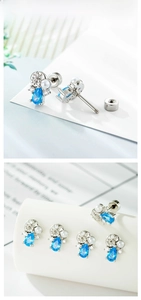 Detail of blue teardrop zircon conch stud with threaded screw back and silver carving