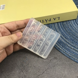 Detailed close-up of flexible translucent silicone mold with cat and bow patterns