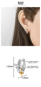 Detail view of star charm earring with cubic zirconia and exact size specifications