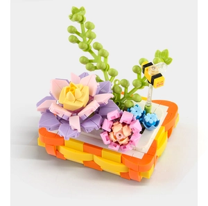 Close-up of building block flower basket with pink lotus and yellow bee accessory