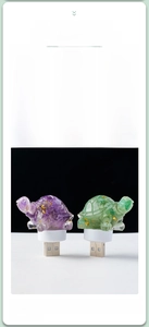 Detail showing tortoise night light with natural purple crystal and gold foil texture