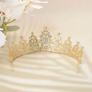 Detail of luxury gold tiara with sparkling rhinestones for wedding and banquet events