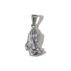 Macro detail of polished stainless steel prayer hands pendant with high gloss finish
