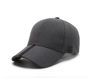 Side view of gray corduroy baseball cap with brand logo details and curved brim