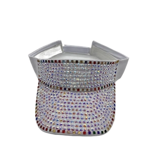 Detail of white sun visor featuring colorful rhinestones and adjustable velcro strap