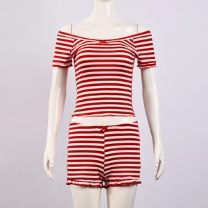Detail of red and white striped rib knit set featuring a bow and ruffled hem shorts