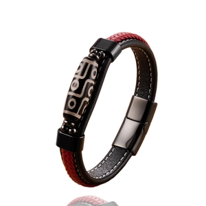 Ethnic leather bracelet featuring a nine-eyed agate bead with magnetic steel clasp
