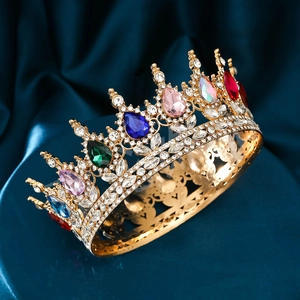 Luxury gold bridal tiara with colorful gemstones and rhinestones on blue silk backdrop