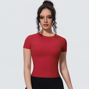 Detail of red slim-fit yoga t-shirt showing breathable fabric and high-elastic stitching