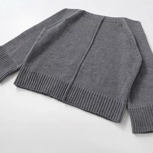 Fashion casual dark grey knit sweater featuring a crew neck and ribbed cuffs in flat lay view
