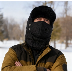 Close-up of winter trapper hat with integrated face mask and warm faux fur lining