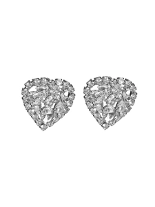 Macro shot of silver heart earrings with sparkling pear and round cut clear crystals