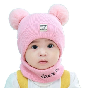 Pink knit baby beanie with double pom-poms and matching scarf featuring embroidery