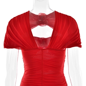 Detailed back view of red mesh dress with elegant bow tie decoration and cutout design