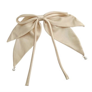 Elegant beige satin bow hair clip with long ribbons and delicate pearl pendants