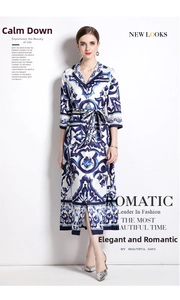 Detail of blue and white floral print maxi shirt dress with collar and waist belt