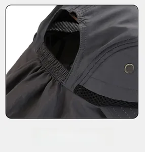 Detail of adjustable elastic band and breathable mesh on dark grey outdoor sun hat