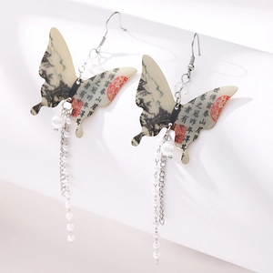 Detail of fan-shaped butterfly earrings with ink painting print and pearl tassels