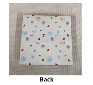 Back view of a white Christmas ball gift box with colorful snowflake and heart patterns
