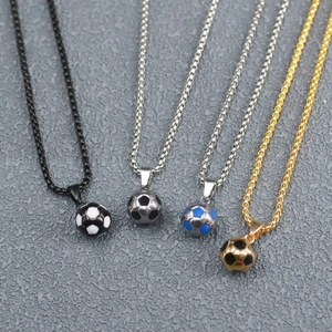 Detail view of four stainless steel football pendants in black, blue, silver, and gold finishes