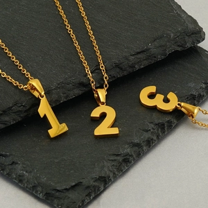Minimalist gold stainless steel necklaces featuring Arabic numerals 1, 2, and 3 pendants