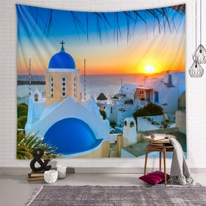 Detail of Santorini tapestry showing blue dome churches and sunset on a white brick wall
