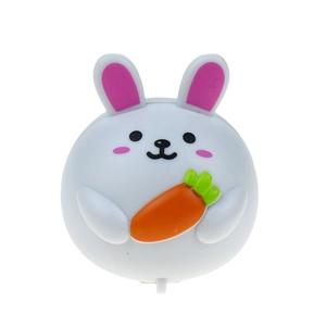 Close-up of cute cartoon rabbit pull-back toy car with carrot and pink ears