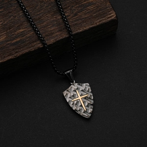 Retro shield necklace with gold cross and textured silver pendant on black bead chain