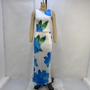Close-up of blue floral print on white sleeveless crop top and high waist maxi skirt set