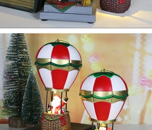 Detailed view of a Christmas hot air balloon resin ornament with Santa Claus and gifts