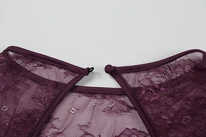 Macro detail of dark purple lace dress back neck closure with fabric button and loop