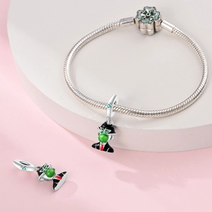 Artistic silver bracelet with green apple surrealist painting pendant detail
