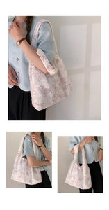 Close-up of a white plush lace tote bag featuring intricate pink butterfly embroidery detail