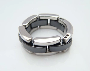 Detail of modern polished silver metal and smooth black links in a chain bracelet
