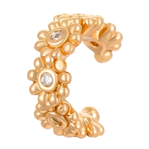 Detailed macro view of gold flower ear cuff with sparkling round crystal inlays