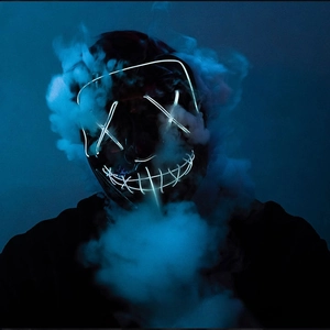 Detail of LED Halloween mask with blue glowing wire and smoke effect for parties