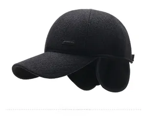 Detail view of winter baseball cap with ear flaps and wool blend texture in black