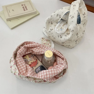 Floral canvas tote bags with beige flower print and pink plaid patterns showing storage capacity