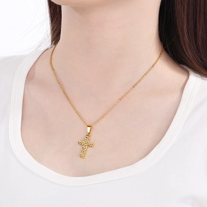 Minimalist 18k gold plated stainless steel cross necklace with textured finish on model