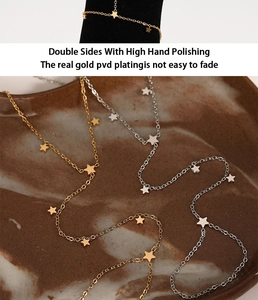 Macro shot of PVD gold plated stainless steel star hand chain with high polish finish