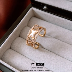 French style gold-plated zircon shell ring with open criss-cross hollow design