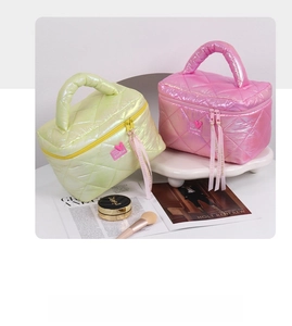 Detail of neon green and pink quilted makeup bags with heart tags and ribbon zippers