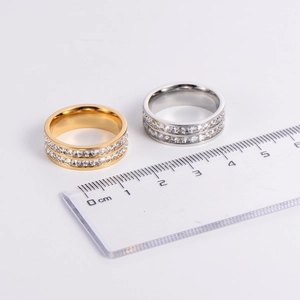 Detailed view of double row zircon rings next to a ruler showing width and diameter