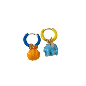 Colorful mismatched enamel earrings featuring blue elephant and orange pumpkin pendants