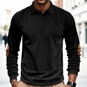Detail of corduroy texture and brown elbow patches on men's black long sleeve polo shirt