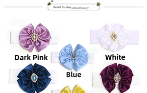 Detail of baby nylon headbands with large satin bows and rhinestone embellishments