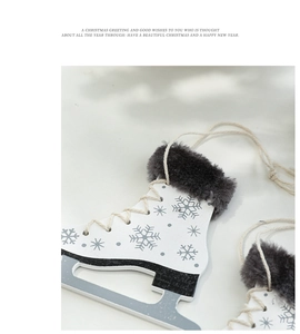Macro view of white wooden ice skate ornament with blue snowflakes and grey faux fur