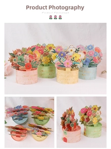 Macro view of 3D pop-up floral greeting cards with gold foil Best Wishes engraving
